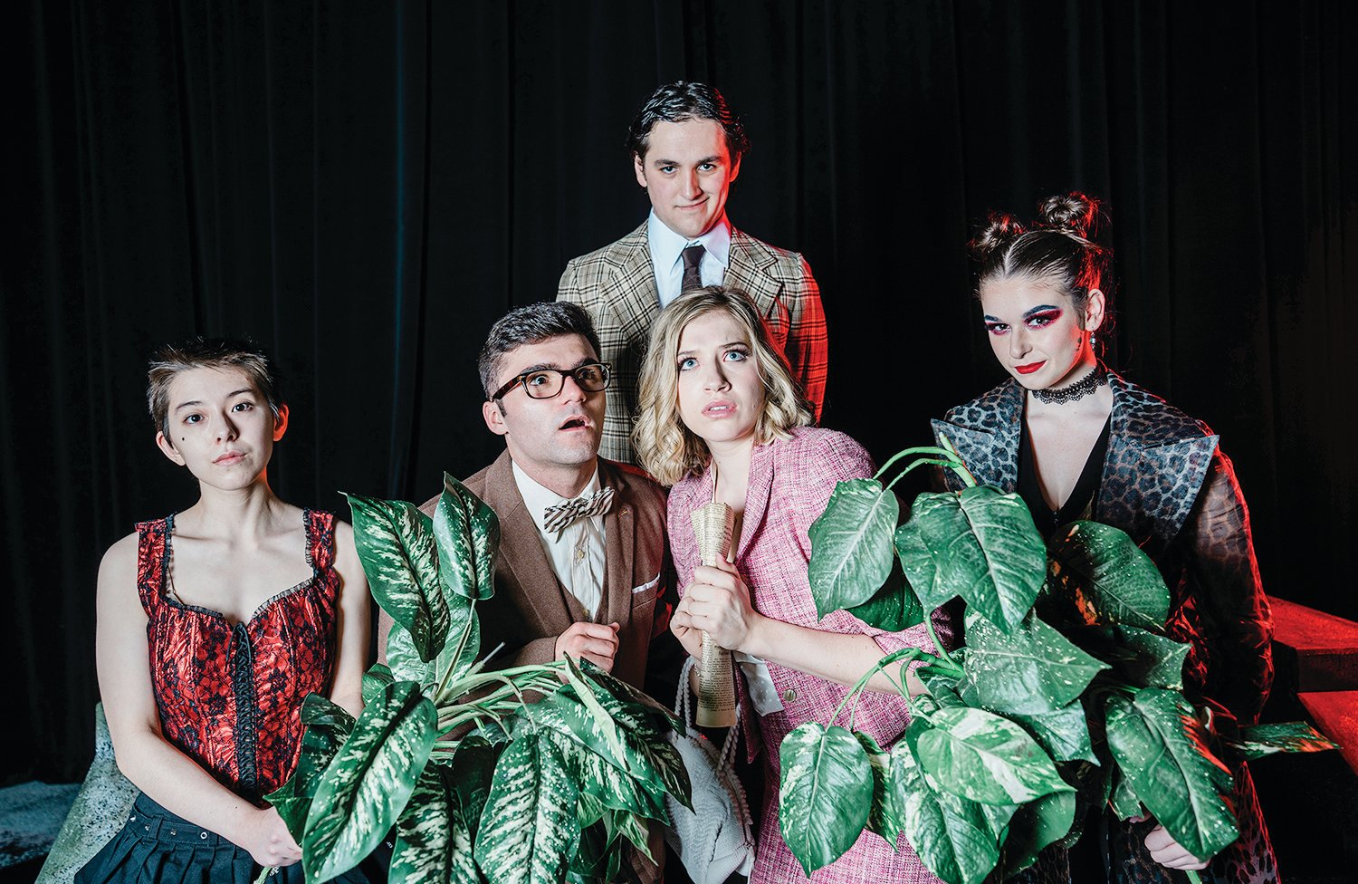 Aidan Costa and Olivia Humulock play the wholesome couple Brad Majors and Janet Weiss in “The Rocky Horror Show.” They are circled by phantoms Zoe Pepin, left, and Jenna Muldoon, right, with the play’s narrator, Justin Peters, in back.